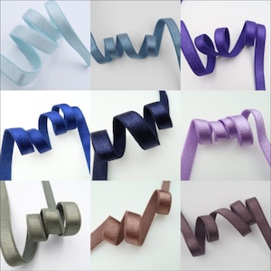 May include: Assortment of 10 colors of 1/2 inch wide satin ribbon. The colors are light blue, dark blue, navy blue, lavender, gray, brown, dark brown, purple, black, and white.