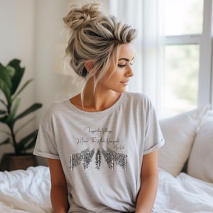 May include: A gray t-shirt with a black graphic of a vineyard and the text "Forget the Village I Need the Whole Vineyard -  Wine Life".