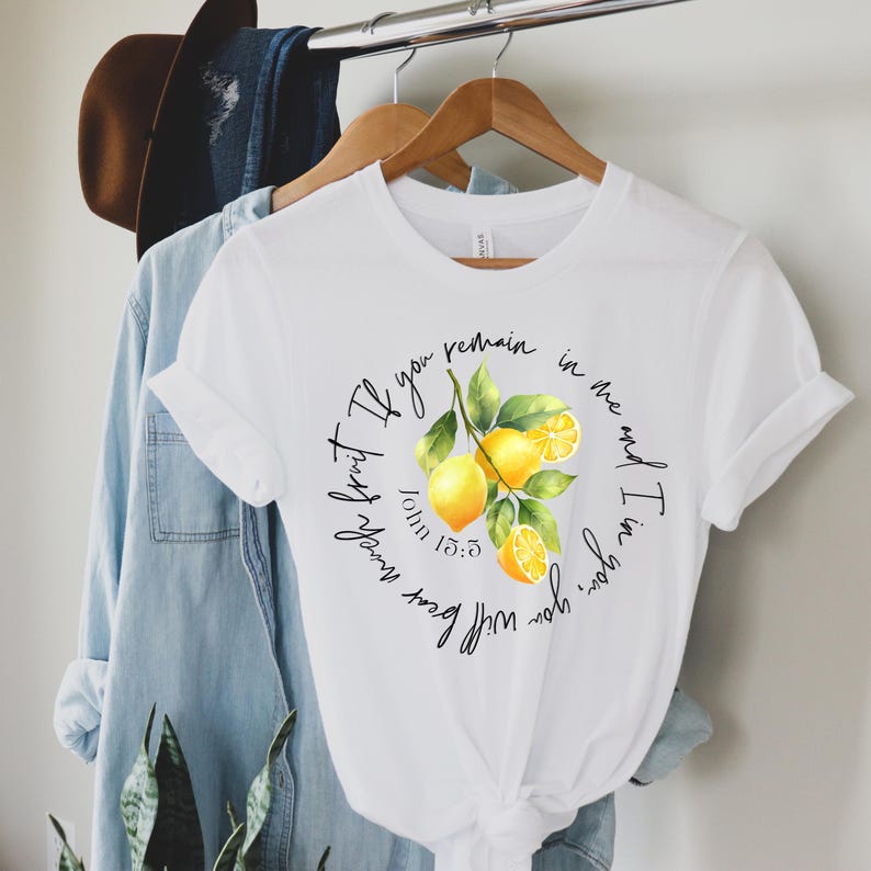 May include: White t-shirt with a lemon graphic and the text "If you remain in me and I in you, you will bear much fruit." John 15:5