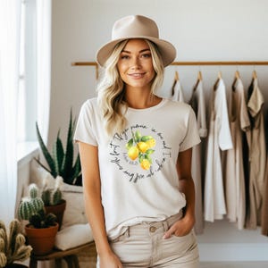 May include: White t-shirt with a lemon graphic and the text "I am the vine, you are the branches. If you remain in me and I in you, you will bear much fruit." John 15:5