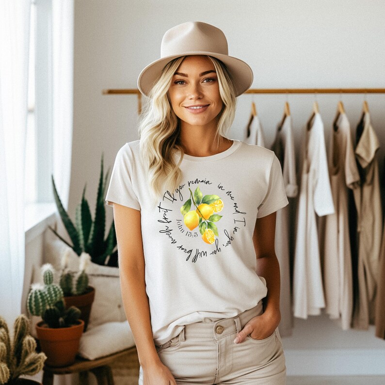 May include: White t-shirt with a lemon graphic and the text "I am the vine, you are the branches. If you remain in me and I in you, you will bear much fruit." John 15:5