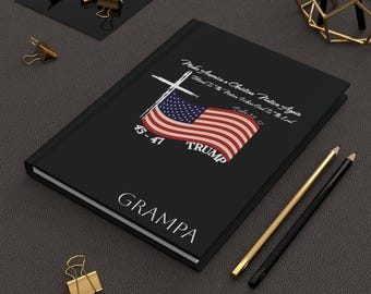 May include: Black notebook with a white cross, American flag, and the text "Make America a Christian Nation Again", "Blessed Is The Nation Whose God Is The Lord", "45-47 TRUMP", and "GRAMPA".