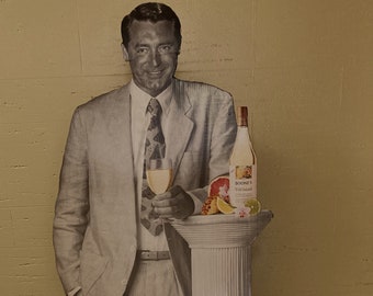 A vintage life-size standee of film-star Cary Grant. A rare item of movie memorabilia.