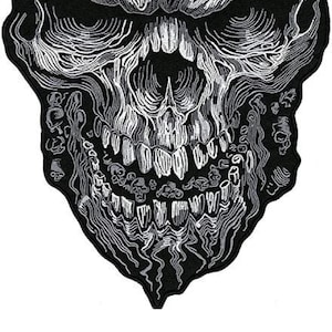 May include: A black and white embroidered skull patch with a detailed design. The skull has a large, toothy grin and a dripping effect.