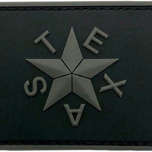 May include: Black patch with a grey five-pointed star and the letters "TEXAS" surrounding it.