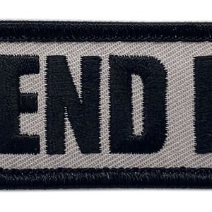 May include: Black embroidered patch with a white background and the text "SEND IT" in bold black letters.