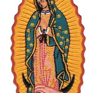 May include: An embroidered patch featuring the Virgin of Guadalupe with a teal mantle, pink dress, and gold star accents. The figure stands on a crescent moon supported by a winged cherub, all surrounded by a vibrant yellow sunburst and red border.