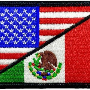May include: A patch with the American and Mexican flags sewn together diagonally. The American flag is on the top left and the Mexican flag is on the bottom right. The flags are sewn together with a black seam.