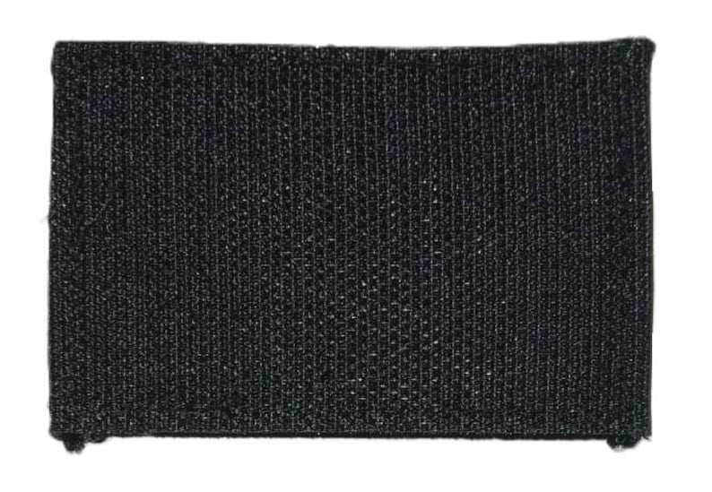 Op de afbeelding: Zwarte klittenband patch. De patch is gemaakt van een textuur stof.