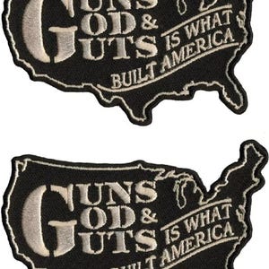 May include: A black and white embroidered patch shaped like the United States of America. The patch features the text "Guns God & Guts Is What Built America".