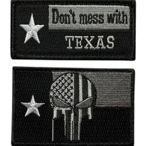 May include: Two black and grey embroidered patches. The first patch features a white star and the text "Don't mess with TEXAS". The second patch features a white star and a grey skull with a US flag pattern.