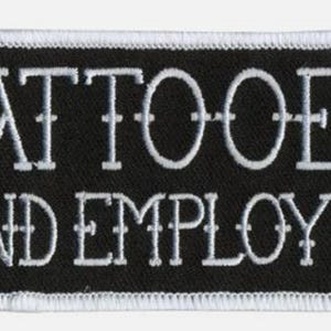 May include: Black and white embroidered patch with the text "Tattooed and Employed".