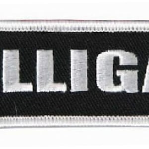 May include: White embroidered patch with a black background and the text "DILLIGAF" in white.