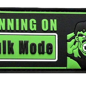 May include: Black and green patch with the text "RUNNING ON HULK MODE" in white and a green cartoon image of the Hulk.