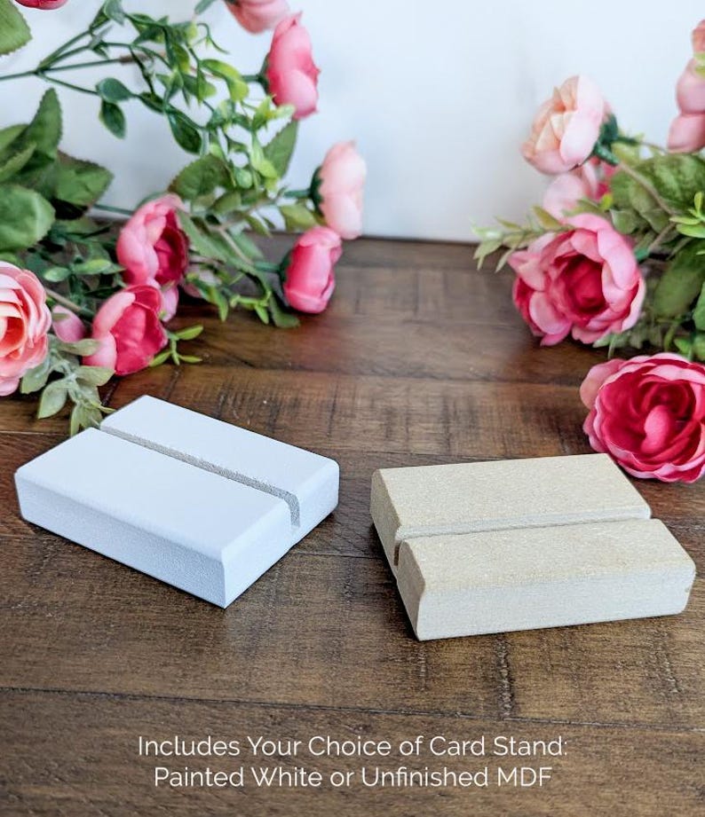 May include: Two card stands, one painted white and one unfinished, made of MDF wood.  Includes Your Choice of Card Stand: Painted White or Unfinished MDF.