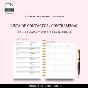 Puede incluir: Lista de contactos y contrase&ntilde;as imprimible en tama&ntilde;o A5. El cuaderno abierto presenta p&aacute;ginas rayadas para detalles de contacto y contrase&ntilde;as, con encuadernaci&oacute;n en espiral dorada. Un bol&iacute;grafo negro y dorado descansa a la derecha. Texto incluye "LISTA DE CONTACTOS".