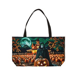 May include: A black tote bag with a Halloween theme. The bag features a spooky scene with a reaper standing in a field of pumpkins, a house in the background, and a full moon.