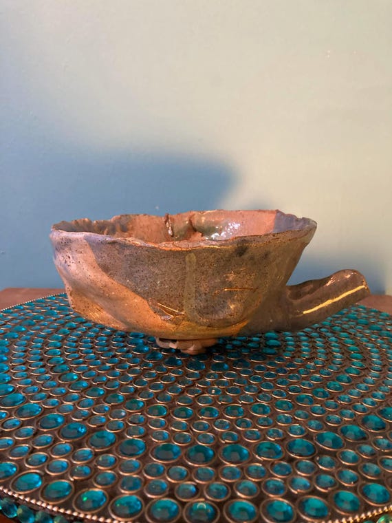 Hand-built brutalist stoneware that straddles functional pottery and abstract sculpture — the kind of piece that stops guests mid-sentence.
