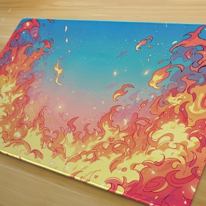 May include: A rectangular mousepad featuring a vibrant illustration of stylized flames in shades of red, orange, and yellow against a gradient blue sky. The mousepad has a smooth surface and the text "SAN CHAN" is visible in the lower left corner.