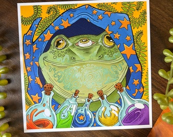 May include: A green frog wearing a blue and orange star patterned robe with a third eye in the center of its forehead. The frog is surrounded by five glass bottles filled with colorful liquids.