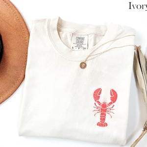 ヴィンテージ ロブスター シャツ コースタル T シャツ マリン T シャツ オーシャン T シャツ 夏用 レディース グラフィック T シャツ トレンディなオーバーサイズ ビーチ シャツ バケーション Ivory