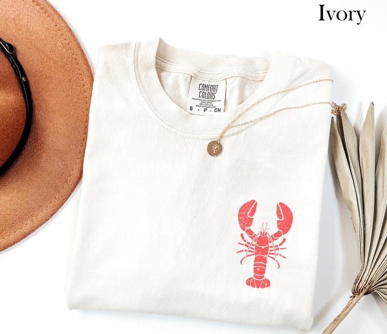 ヴィンテージ ロブスター シャツ コースタル T シャツ マリン T シャツ オーシャン T シャツ 夏用 レディース グラフィック T シャツ トレンディなオーバーサイズ ビーチ シャツ バケーション Ivory