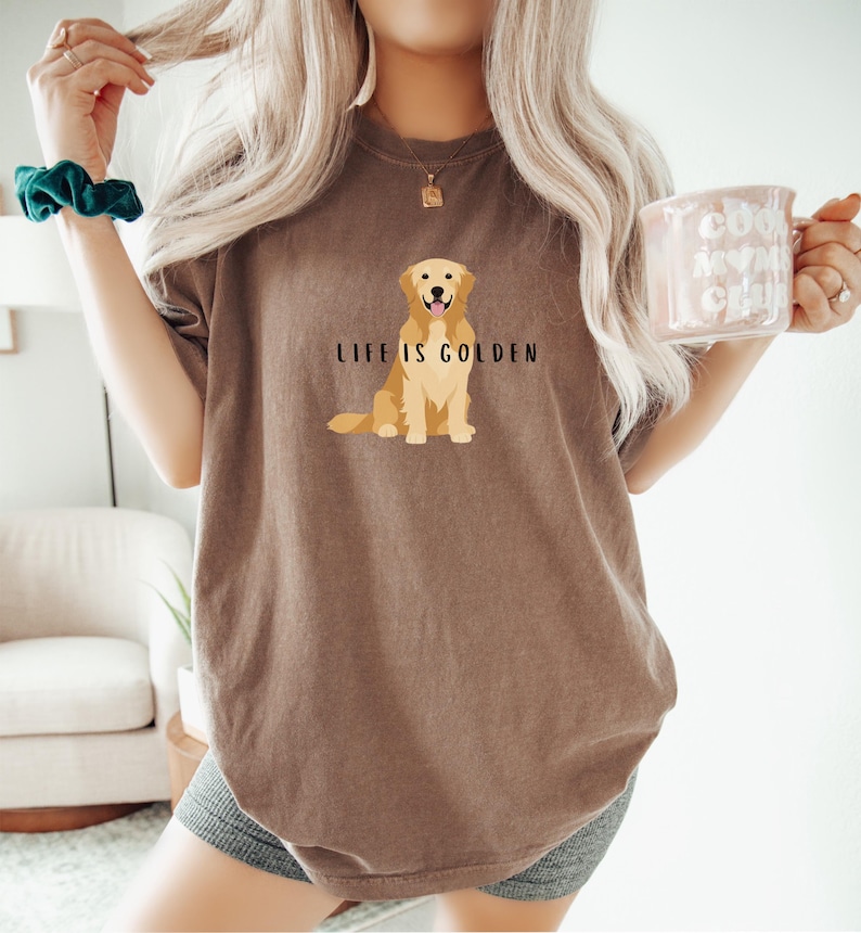 May include: A brown t-shirt with a golden retriever illustration and the text "Life is Golden".