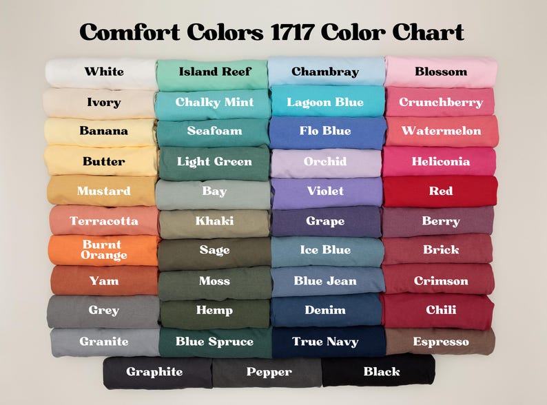May include: Color chart titled "Comfort Colors 1717 Color Chart" displaying a variety of fabric colors. Colors include white, ivory, banana, butter, mustard, terracotta, burnt orange, yam, grey, granite, graphite, island reef, chalky mint, seafoam, light green, bay, khaki, sage, moss, hemp, blue spruce, pepper, chambray, lagoon blue, flo blue, orchid, violet, grape, ice blue, blue jean, denim, true navy, blossom, crunchberry, watermelon, heliconia, red, berry, brick, crimson, chili, espresso, and black.