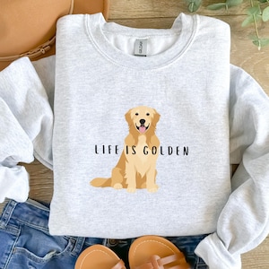 Może przedstawiać: Szara bluza z nadrukiem złotego retrievera i tekstem "Life is Golden".
