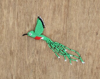 Beaded hummingbird pattern (green, red, and white)