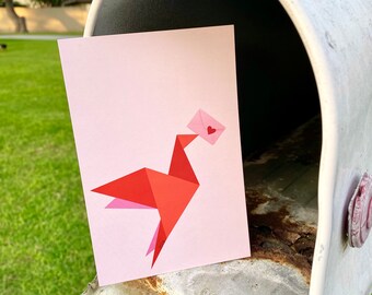 Postcard: an origami bird holding an envelope with a heart / matches 2024 love stamp