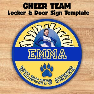 May include: A circular cheer team locker and door sign template featuring the text CHEER TEAM Locker & Door Sign Template, EMMA, and WILDCATS CHEER. The design includes a blue and yellow color scheme, a paw print graphic, and a photo of a cheerleader.