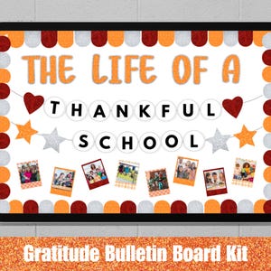 May include: A framed bulletin board with the text "THE LIFE OF A THANKFUL SCHOOL" in orange letters. The board features photos, hearts, and stars. The words "Gratitude Bulletin Board Kit" are at the bottom.