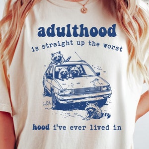 Adulthood Is the Worst Hood I&#39;ve Ever Live In Comfort Colors® T-Shirt, Funny Graphic Vintage Retro Raccoon Shirt, Funny Mental Health Shirt