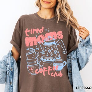 May include: A set of three ceramic mugs with a speckled, matte finish. The mugs are in shades of cream, light gray, and dark gray. Each mug has a simple, minimalist design, perfect for coffee or tea.