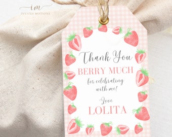 May include: Pink and white gingham thank you tag with a watercolor strawberry border. The text reads "Thank You Berry Much for celebrating with me! Love, Lolita".
