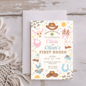 May include: A white invitation with a colorful western theme. The invitation says "Saddle Up and Join Us to Celebrate Olivia and Oliver's First Rodeo". The invitation includes a date, time, and location for the event.