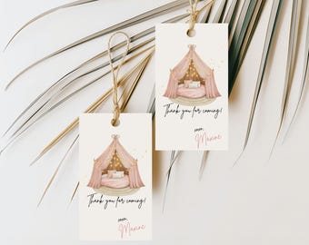 May include: Two gift tags featuring a pink canopy bed illustration and the text "Thank you for coming!" and "xoxo, Maxine". The tags are tied with twine against a white background with palm leaves.