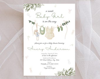 May include: A baby shower invitation with a watercolor illustration of a clothesline with baby clothes hanging on it. The text reads "a sweet Baby Girl is on the way" and "please join us for a baby shower honoring Avery Anderson".