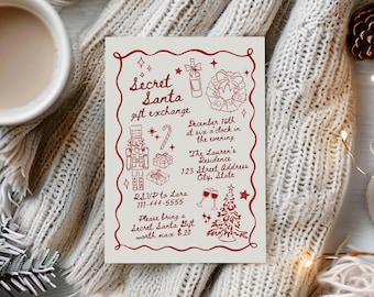 May include: A cream-colored Secret Santa gift exchange invitation with red text and illustrations. The invitation includes details for the event, such as the date, time, location, and RSVP information. The invitation is surrounded by a cozy, white knitted blanket.