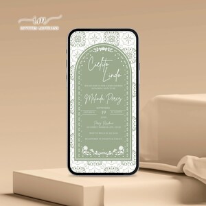 May include: A smartphone screen shows a baby shower invitation with the words "Cielito Lindo". The invitation has a green and white floral design, with event details including the date, time, and location, displayed in a decorative font.