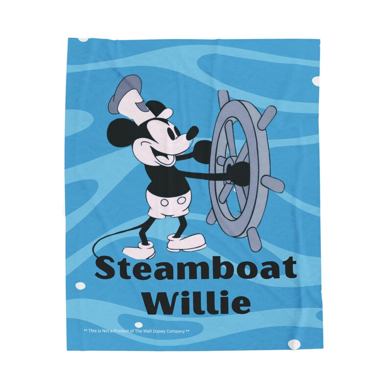 May include: A blue blanket featuring Mickey Mouse as Steamboat Willie, steering a ship's wheel. The blanket has a light blue background with wave patterns and the text "Steamboat Willie".