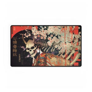 May include: A rectangular mousepad featuring a striking illustration. The artwork depicts a skull with horns, a skeleton, and a woman in a kimono, set against a backdrop of cherry blossoms and Japanese text. The color palette includes red, black, and cream.