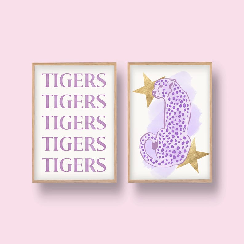 May include: Two framed prints, one with the word "TIGERS" repeated five times in a purple font, and the other with a purple cheetah sitting on a pink watercolor background with gold stars.