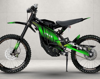May include: An electric dirt bike featuring a black frame with vibrant green graphic decals. The bike includes a front fender, a black seat, knobby tires, disc brakes, and a kickstand. The frame displays the text "SUR-RON" in a stylized font.