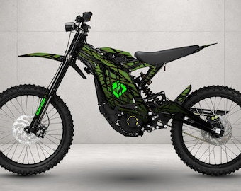 May include: An electric dirt bike featuring a black frame with a vibrant green and black geometric pattern across the body. The bike includes a black seat, knobby tires, front and rear disc brakes, and a prominent green logo on the side panel.