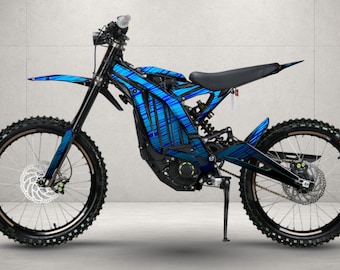 May include: An electric dirt bike featuring a frame and body panels with a blue and black diagonal striped pattern. The bike includes a black seat, black handlebars, front and rear disc brakes, knobby tires, and a kickstand for stability.
