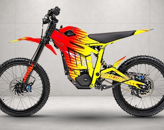 May include: An electric dirt bike featuring a vibrant red and yellow gradient frame with a dot pattern. The bike has black knobby tires, a black seat, and the word STING printed in yellow on the rear swingarm. It includes a front fender and disc brakes.