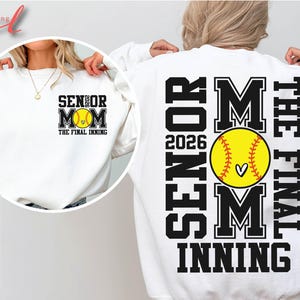 May include: White sweatshirt with black text that reads "Senior Mom The Final Inning 2026" and a softball graphic.
