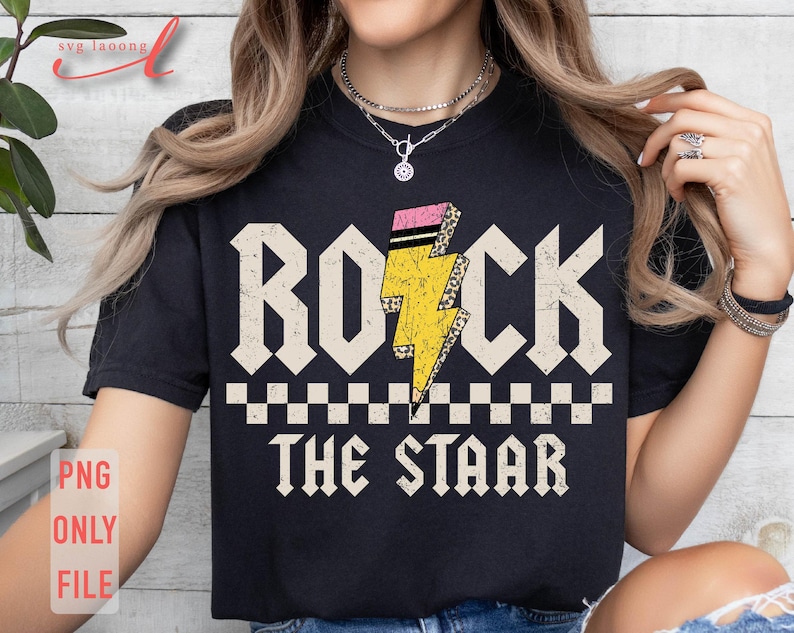 May include: Black t-shirt with a yellow lightning bolt graphic and the text "Rock the Star" in white.